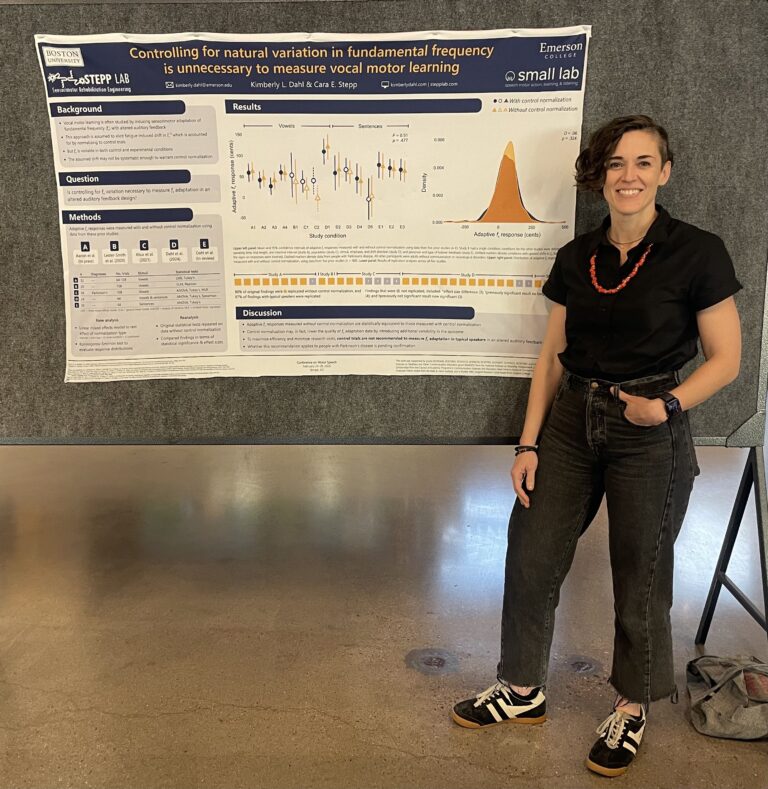 Kimberly Dahl standing by her poster